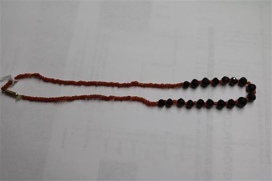 A triple strand coral bead bracelet with French silver mark, a coral and facetted bead necklace and a coral mounted clasp.